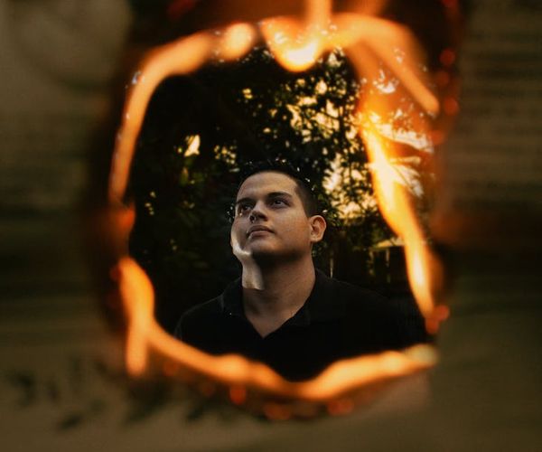 Silhouette of a man with perfect posture against a light background.